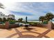 View of outdoor patio seating area with a table and beach access at 1520 Gulf Blvd # Ph2, Clearwater Beach, FL 33767