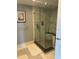 Modern bathroom featuring a sleek glass shower with marble tile at 1520 Gulf Blvd # Ph2, Clearwater Beach, FL 33767