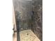 Modern bathroom featuring a glass shower with dark marble tile at 1520 Gulf Blvd # Ph2, Clearwater Beach, FL 33767