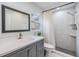 Bathroom showcasing a modern vanity, shower with tiled walls, and sleek fixtures at 1905 Dove Field Pl, Brandon, FL 33510