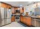 Modern kitchen with stainless steel appliances, granite countertops, mosaic tile backsplash and wood cabinetry at 1905 Dove Field Pl, Brandon, FL 33510