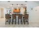 Kitchen featuring pendant lighting over a breakfast bar with woven chairs and tile flooring at 1905 Dove Field Pl, Brandon, FL 33510