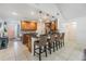 Kitchen with pendant lights, stainless appliances, breakfast bar with woven chairs, and tiled backsplash at 1905 Dove Field Pl, Brandon, FL 33510