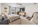 Inviting primary bedroom with large window, ceiling fan, and comfortable seating area at 1905 Dove Field Pl, Brandon, FL 33510