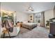 Comfortable primary bedroom with a ceiling fan, lots of natural light, and neutral tones at 1905 Dove Field Pl, Brandon, FL 33510