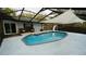 Relaxing screened-in pool with a slide, and lounge chairs, offering a perfect retreat at 1905 Dove Field Pl, Brandon, FL 33510