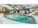 Refreshing pool with slide, offers a perfect blend of fun and relaxation in a screened enclosure at 1905 Dove Field Pl, Brandon, FL 33510