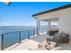Expansive waterfront balcony with seating and railing offering stunning views of the water and city skyline at 1906 Carolina Ne Ave, St Petersburg, FL 33703