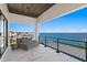 This waterfront home features a luxury balcony with comfortable seating and beautiful water views at 1906 Carolina Ne Ave, St Petersburg, FL 33703