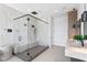 Bright bathroom showcasing a glass enclosed shower with bench, marble wall and modern fixtures at 1906 Carolina Ne Ave, St Petersburg, FL 33703