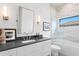 Modern bathroom with a vanity, mirror, and a bathtub-shower combo at 1906 Carolina Ne Ave, St Petersburg, FL 33703