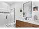 Modern bathroom featuring shower, vanity and stylish lighting at 1906 Carolina Ne Ave, St Petersburg, FL 33703