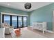 Tranquil Bedroom with water views and a decorative flamingo rocker at 1906 Carolina Ne Ave, St Petersburg, FL 33703