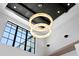 Modern ceiling with two ring chandelier and a large window at 1906 Carolina Ne Ave, St Petersburg, FL 33703