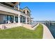 Stunning waterfront home with a pool, dock, and beautifully landscaped lawn offering luxurious outdoor living at 1906 Carolina Ne Ave, St Petersburg, FL 33703