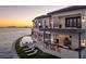 Luxury waterfront home at sunset with infinity pool and outdoor kitchen at 1906 Carolina Ne Ave, St Petersburg, FL 33703