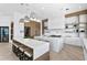 Open kitchen with an island, wine fridge, stylish lighting, and seamless access to appliances at 1906 Carolina Ne Ave, St Petersburg, FL 33703