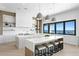 This modern, eat-in kitchen features an island, pendant lighting, and sleek countertops at 1906 Carolina Ne Ave, St Petersburg, FL 33703