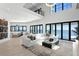 This spacious living room features contemporary decor, large windows, and seamless indoor-outdoor flow at 1906 Carolina Ne Ave, St Petersburg, FL 33703