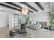 Bright main bedroom features a chandelier, dark wood beams, and a large closet at 1906 Carolina Ne Ave, St Petersburg, FL 33703