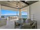 Waterfront outdoor dining area features a full kitchen, bar, and wood dining table with seating at 1906 Carolina Ne Ave, St Petersburg, FL 33703
