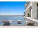 Luxury waterfront home with infinity pool, lounge chairs, and panoramic views of the city skyline at 1906 Carolina Ne Ave, St Petersburg, FL 33703