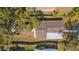 Aerial shot showing the roof of a home and a detached garage with the fence line at 1941 48Th S St, St Petersburg, FL 33711