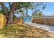 Exterior view of the turquoise shed in a backyard setting with a fence at 1941 48Th S St, St Petersburg, FL 33711