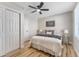 Comfortable bedroom with wood floors, a ceiling fan, closet, and cozy bedding for a relaxing atmosphere at 1941 48Th S St, St Petersburg, FL 33711