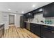 Beautiful kitchen showcasing dark cabinets, stainless steel appliances, and modern finishes at 1941 48Th S St, St Petersburg, FL 33711