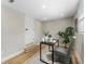 Office area with a modern desk setup, decor, and wood floors, illuminated by natural light at 1941 48Th S St, St Petersburg, FL 33711