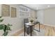 Office space with natural light, desk, decor, a neutral rug and wood-look flooring at 1941 48Th S St, St Petersburg, FL 33711