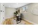 Bright office area features desk, chair, decor, wood-look flooring, and ample natural light at 1941 48Th S St, St Petersburg, FL 33711