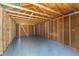 Inside of the shed featuring bare walls, wooden beams, and a light gray floor at 1941 48Th S St, St Petersburg, FL 33711