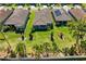 Aerial view showcasing the property with a manicured lawn, landscaping and a covered patio at 20173 Umbria Hill Dr, Tampa, FL 33647