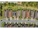 Overhead view of homes featuring well-maintained landscaping, paved walkways and driveways with solar panels on one roof at 20173 Umbria Hill Dr, Tampa, FL 33647