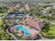Community with pool, clubhouse, tennis courts, and manicured landscaping in a residential area at 20173 Umbria Hill Dr, Tampa, FL 33647