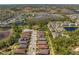 Stunning aerial view of a new residential community featuring lush greenery, small lakes and sidewalks throughout at 20173 Umbria Hill Dr, Tampa, FL 33647