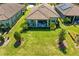 Aerial view of property featuring backyard, lush landscaping, and a covered patio at 20173 Umbria Hill Dr, Tampa, FL 33647