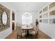Elegant dining room with hardwood floors, a large table, and ample natural light at 20173 Umbria Hill Dr, Tampa, FL 33647