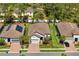 Beautiful single-story homes with tile roofs, brick driveways, lush lawns, and two-car garages at 20173 Umbria Hill Dr, Tampa, FL 33647