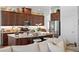 Spacious kitchen with stainless appliances, dark wood cabinetry, and a large center island at 20173 Umbria Hill Dr, Tampa, FL 33647