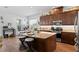 Spacious kitchen with stainless appliances, dark wood cabinetry, and a large center island at 20173 Umbria Hill Dr, Tampa, FL 33647