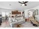 Bright living room with wood-look floors, open layout, and modern furnishings at 20173 Umbria Hill Dr, Tampa, FL 33647