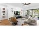 Cozy living room with a ceiling fan, entertainment center, and comfortable seating area at 20173 Umbria Hill Dr, Tampa, FL 33647