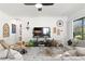 Bright living room with neutral decor, large windows and comfortable seating arrangements at 20173 Umbria Hill Dr, Tampa, FL 33647