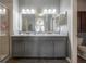 Bathroom features a spacious double sink vanity and a separate glass enclosed shower at 20319 Starfinder Way, Tampa, FL 33647