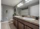 Bathroom featuring double vanity sinks, tile floors and neutral decor for an updated look at 20319 Starfinder Way, Tampa, FL 33647