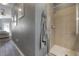 Bathroom features a glass enclosed shower and is accessed down a short hallway at 20319 Starfinder Way, Tampa, FL 33647