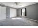 Neutral bedroom with a closet, window and fan providing a calm space at 20319 Starfinder Way, Tampa, FL 33647